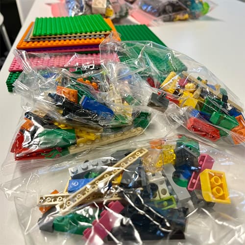 Lego packs on a white table