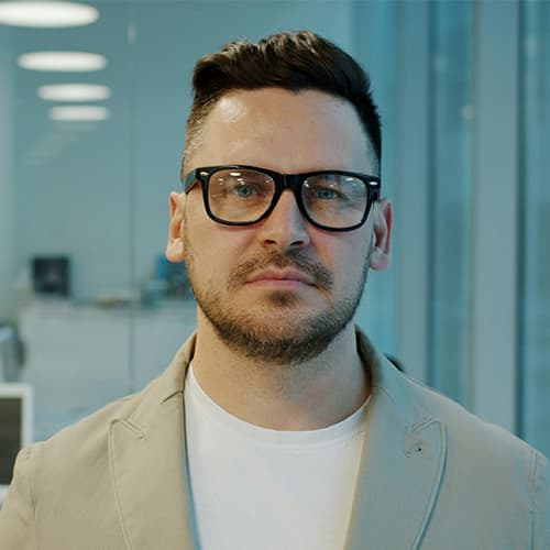 Business man looking into the camera.