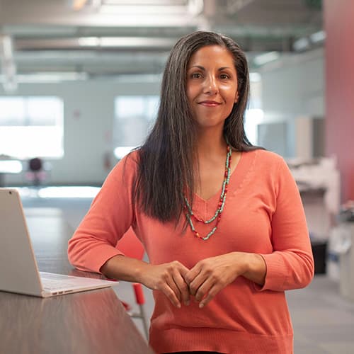 Business woman looking into the camera.